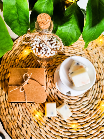 birds eye view of cute matches the packaging the peony scented wax melts come in and a small wax melt burner